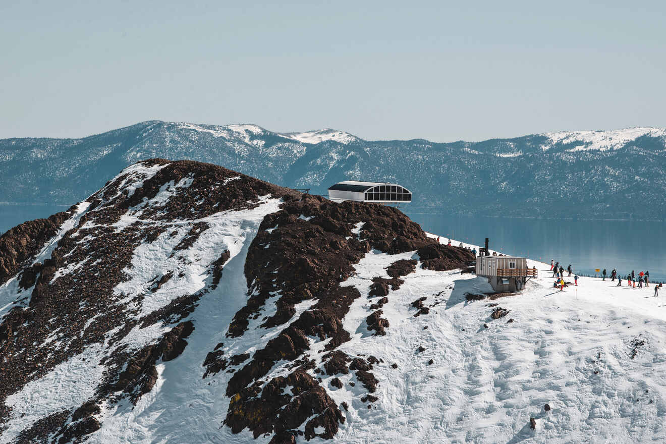 aerial view of a valley covered with snow and a gondola ride on the top of a hill